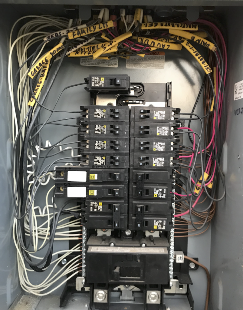 Electrical Panel Repair Encinitas — licensed electrician inspecting residential breaker panel and wiring