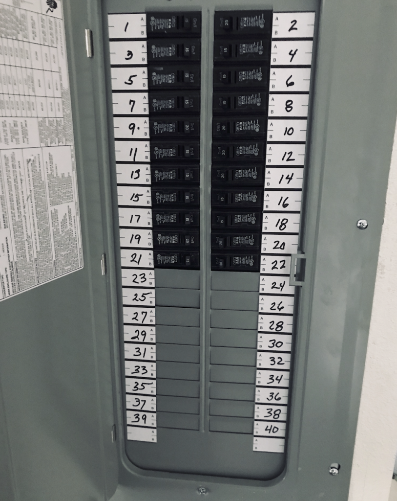 Electrical Panel Repair Encinitas — residential breaker panel with numbered circuit labels by a licensed electrician